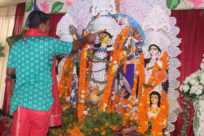 Aarti being performed to the Durga idol