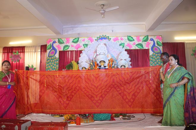 Committee members presenting a saree offering