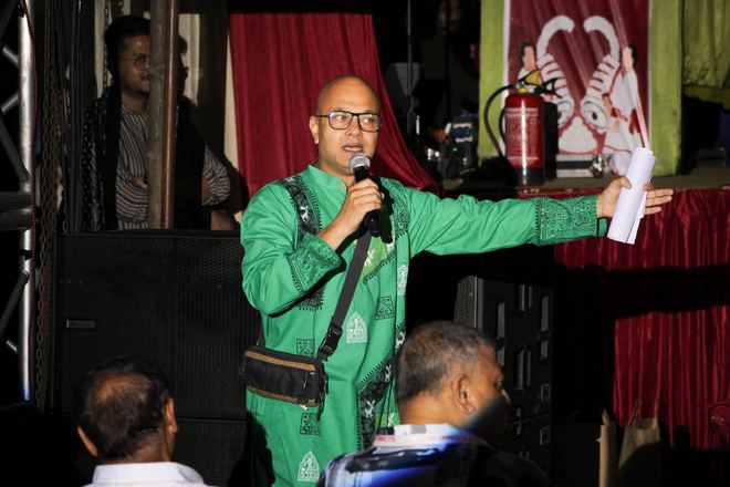 Speaker addressing the audience on stage