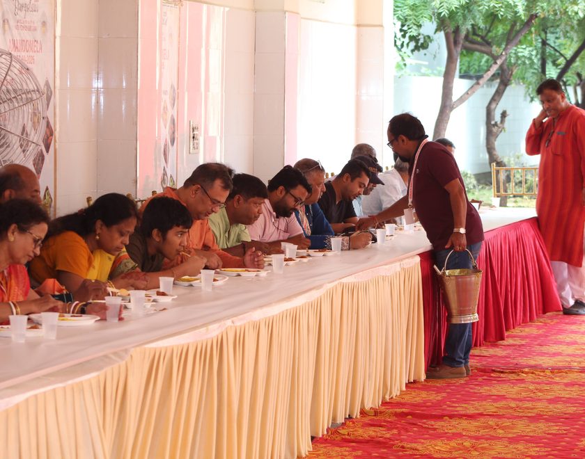 Volunteers distributing food to children in the community